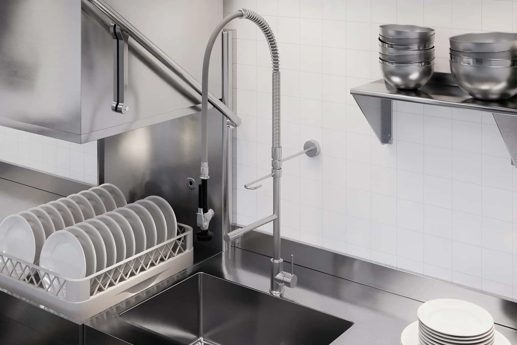 Stainless steel commercial kitchen sink with a flexible faucet, dish rack with white plates, and metal bowls on a wall shelf.
