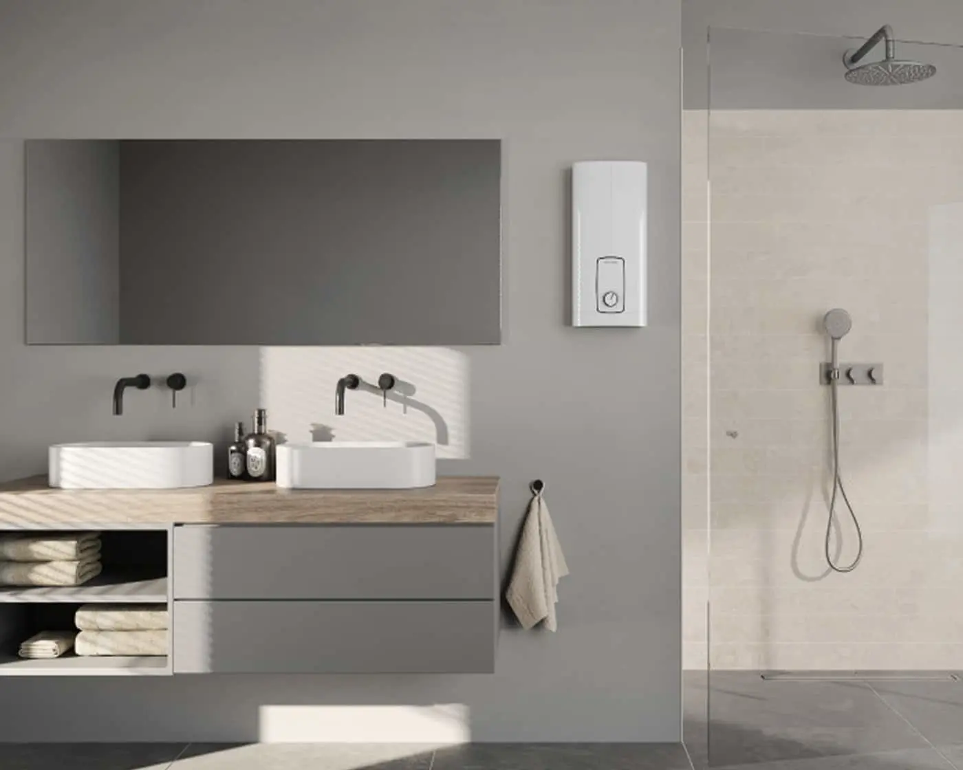 Modern bathroom with double vessel sinks, gray vanity, large mirror, white water heater, and walk-in shower with rainfall head.