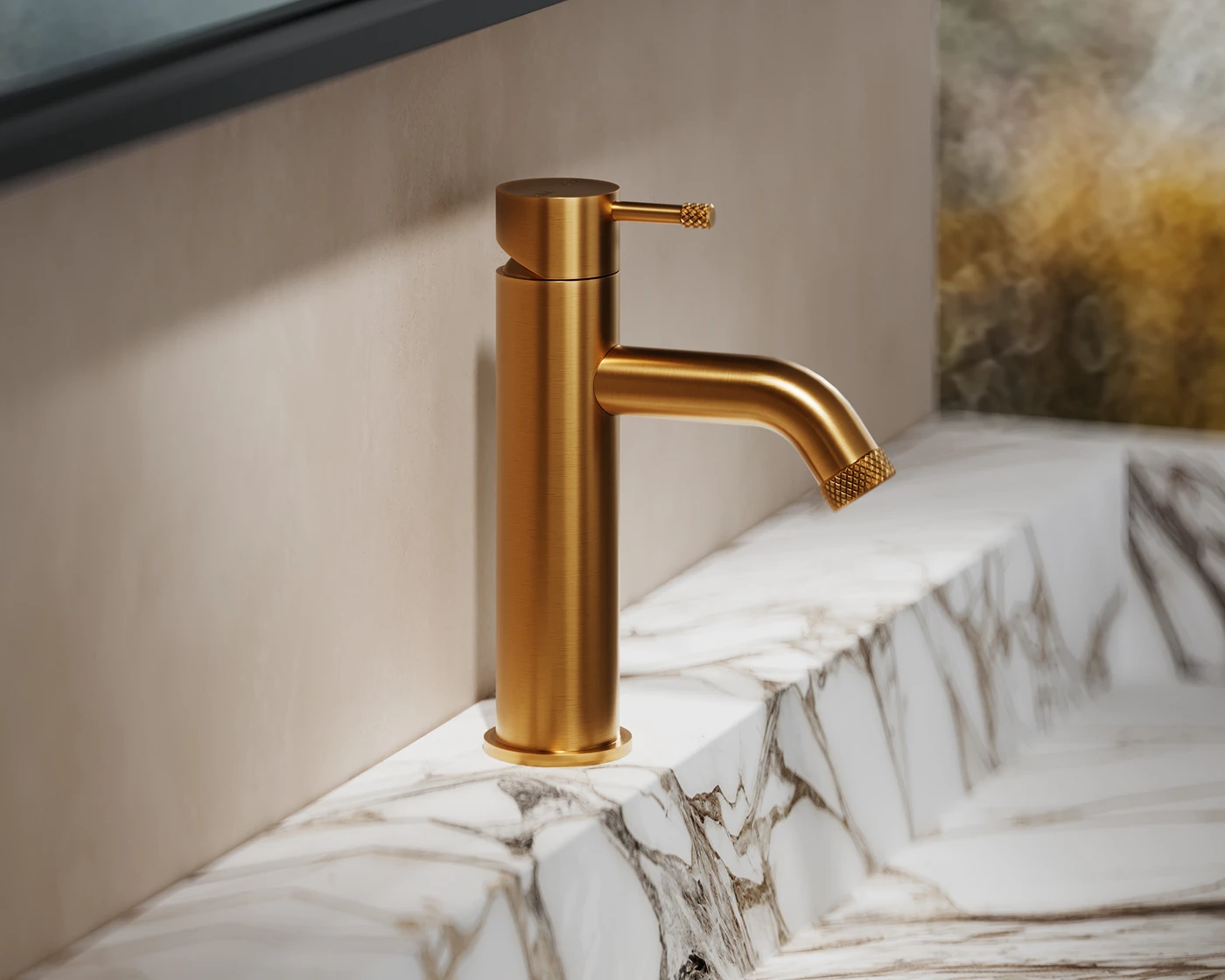 Gold bathroom faucet with textured details mounted on white marble countertop against neutral wall.