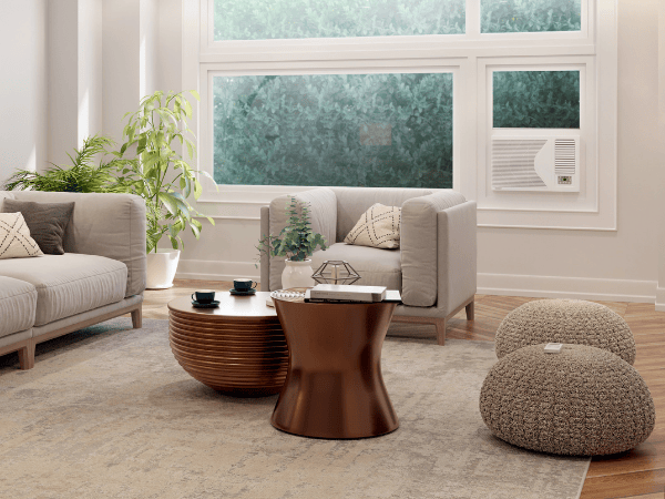 Modern living room with beige sofas, wooden coffee tables, knitted poufs, and houseplants near large windows.