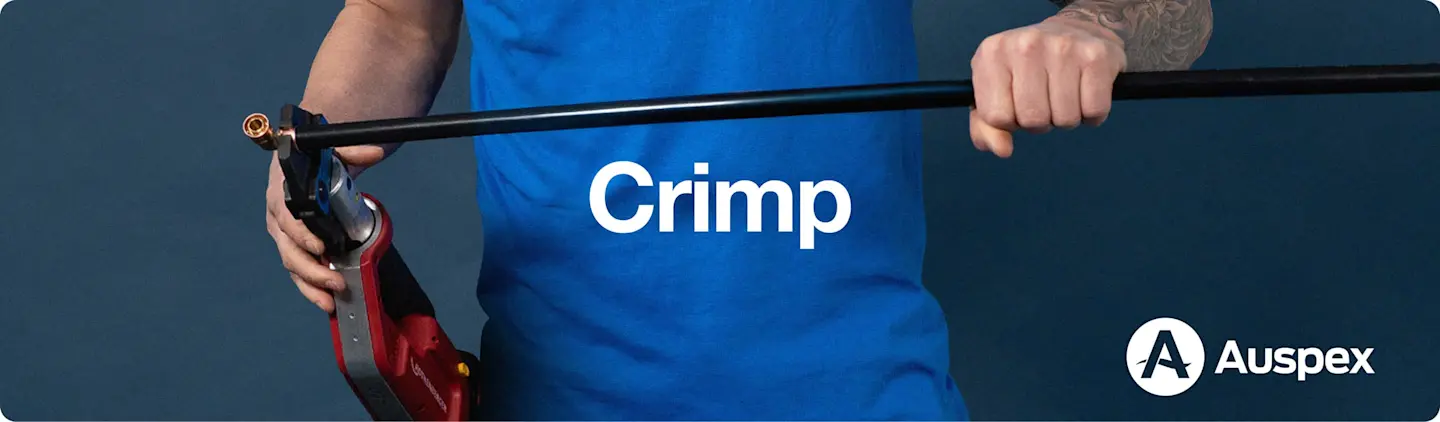Person in blue shirt holding a crimping tool with "Crimp" text and Auspex logo on dark background.