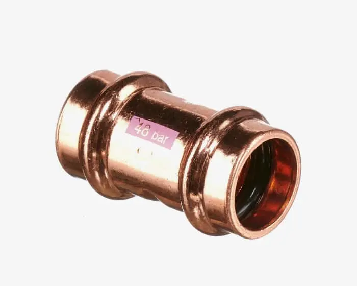 Copper pipe fitting showing cylindrical connector with crimped ends for plumbing installation.