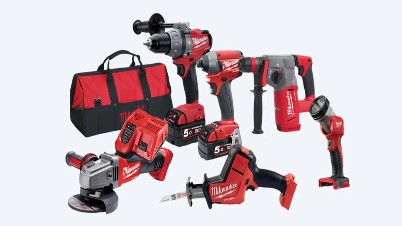 Milwaukee power tool set including drill, impact driver, hammer drill, angle grinder, saw, flashlight, batteries and carrying bag.