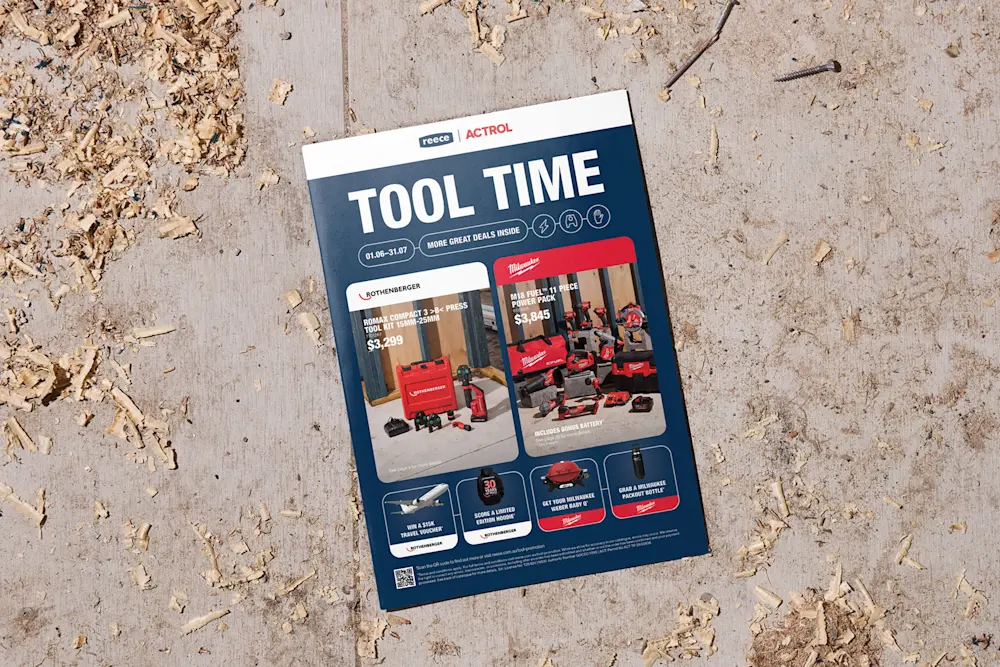 A Reece Actrol "Tool Time" promotional catalogue on a wooden surface covered with wood shavings.
