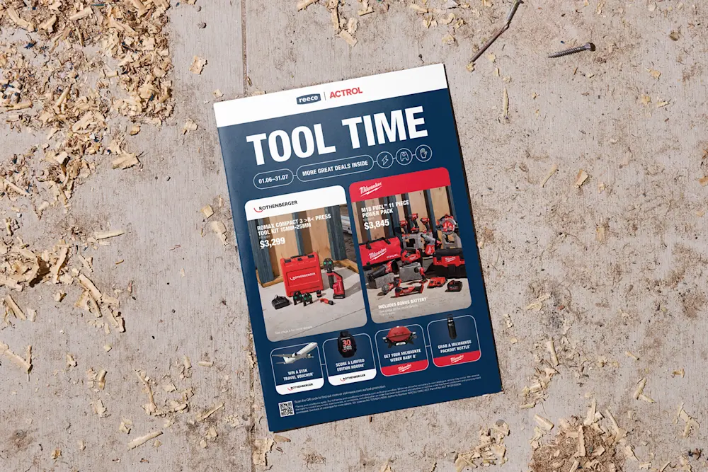 A Reece Actrol "Tool Time" promotional catalogue on a wooden surface covered with wood shavings.