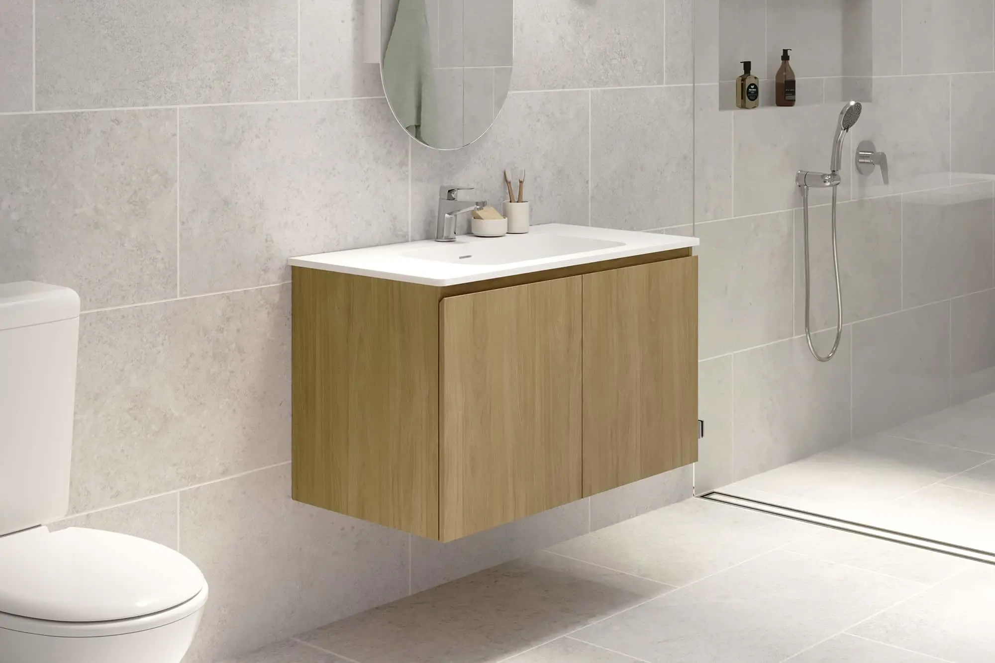 Modern bathroom with floating wooden vanity, white sink, round mirror, light gray tile walls, and shower fixture.