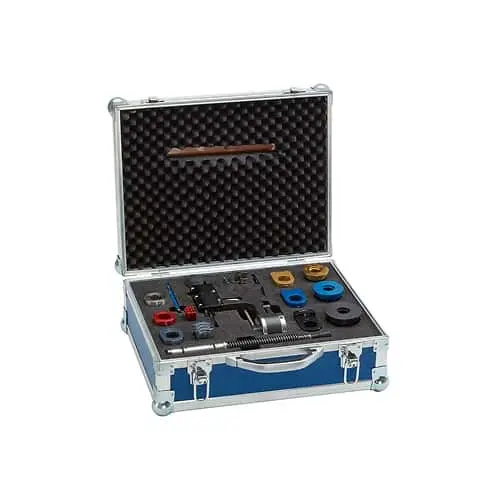 Open blue metal case containing plumbing tools and pipe fittings with foam padding interior.
