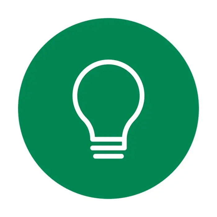 White lightbulb icon on a circular green background, representing an idea or innovation concept.
