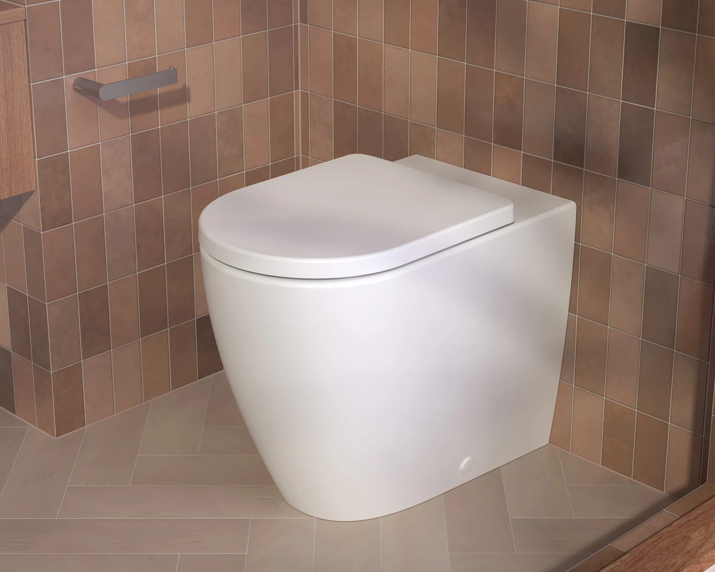 Modern white wall-mounted toilet with closed lid in bathroom with brown tiled walls and floor.