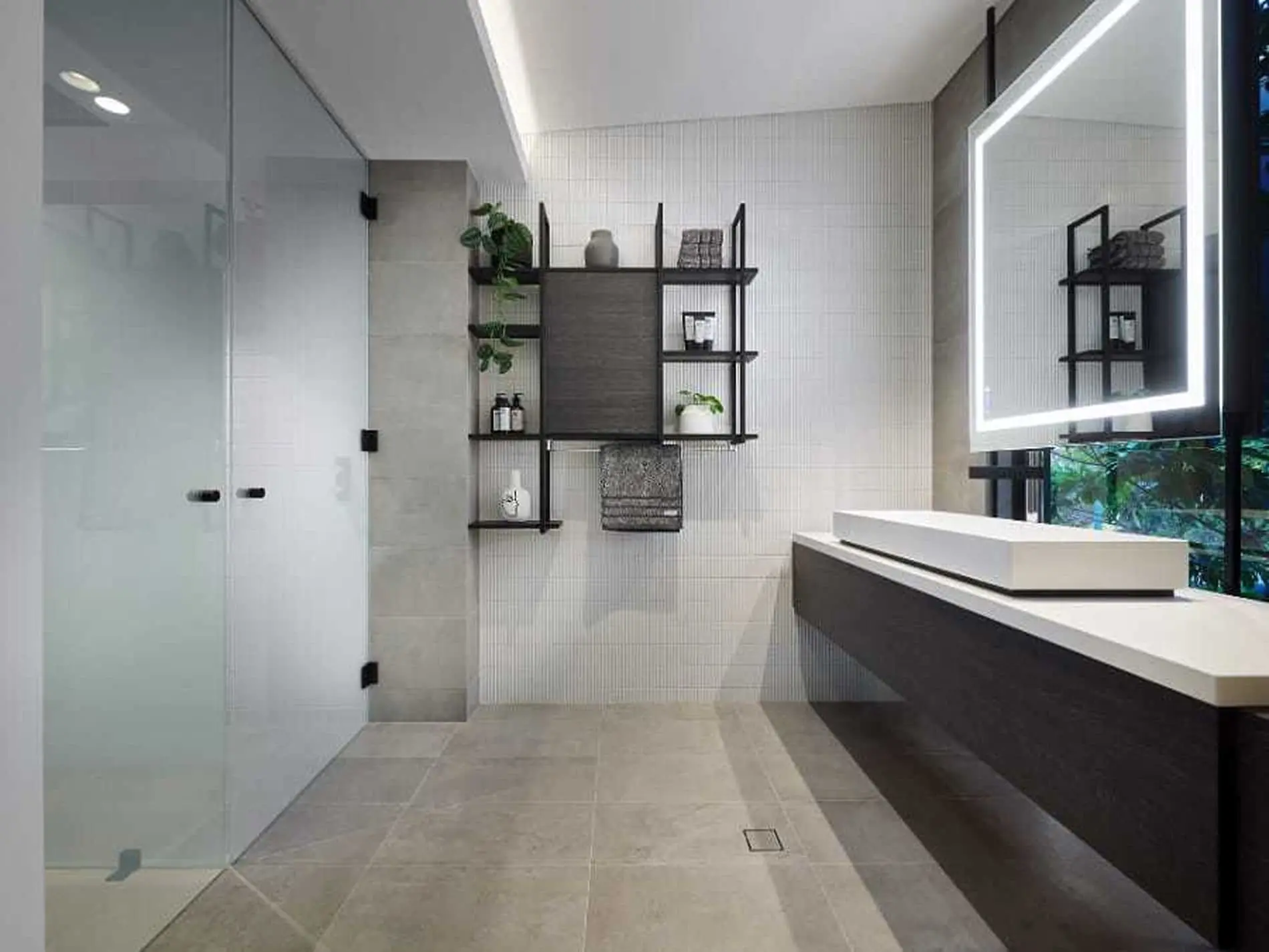 Modern bathroom with glass shower, floating vanity, LED mirror, and black shelving unit holding plants and toiletries.