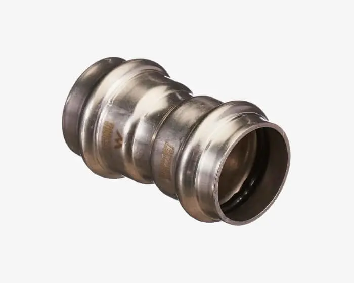 Metallic pipe coupling with ridged design and smooth ends, used for connecting plumbing pipes.