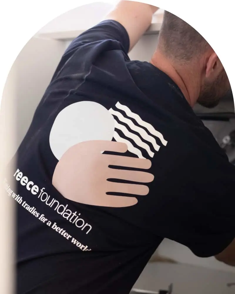 Person wearing a navy blue t-shirt with Reece Foundation logo.