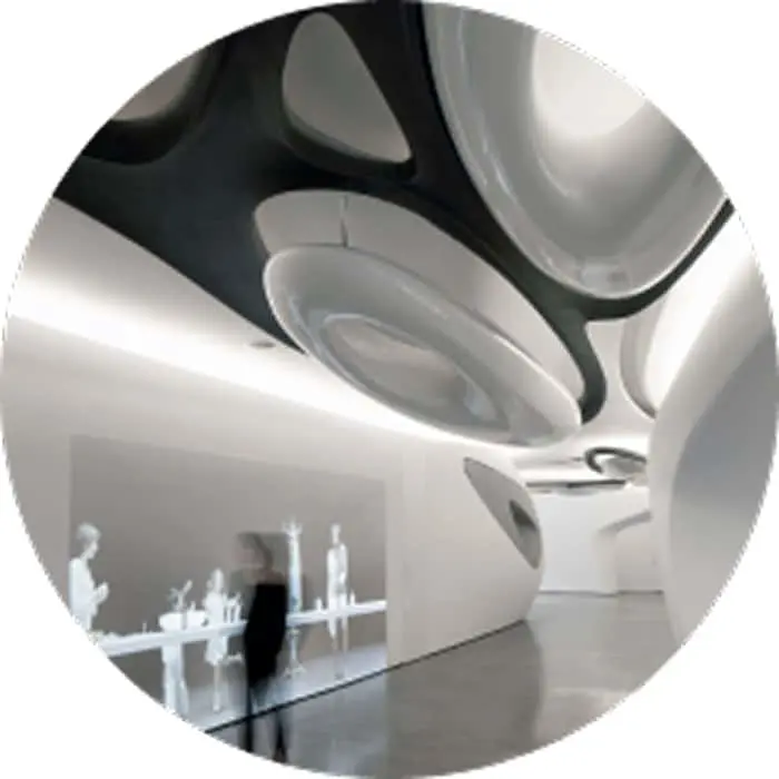 Modern interior with curved white ceiling featuring black accents and minimalist exhibition space below.