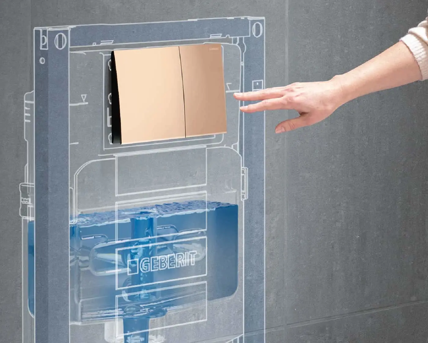 Hand reaching toward a gold flush plate on a Geberit in-wall toilet system with transparent diagram showing internal components.