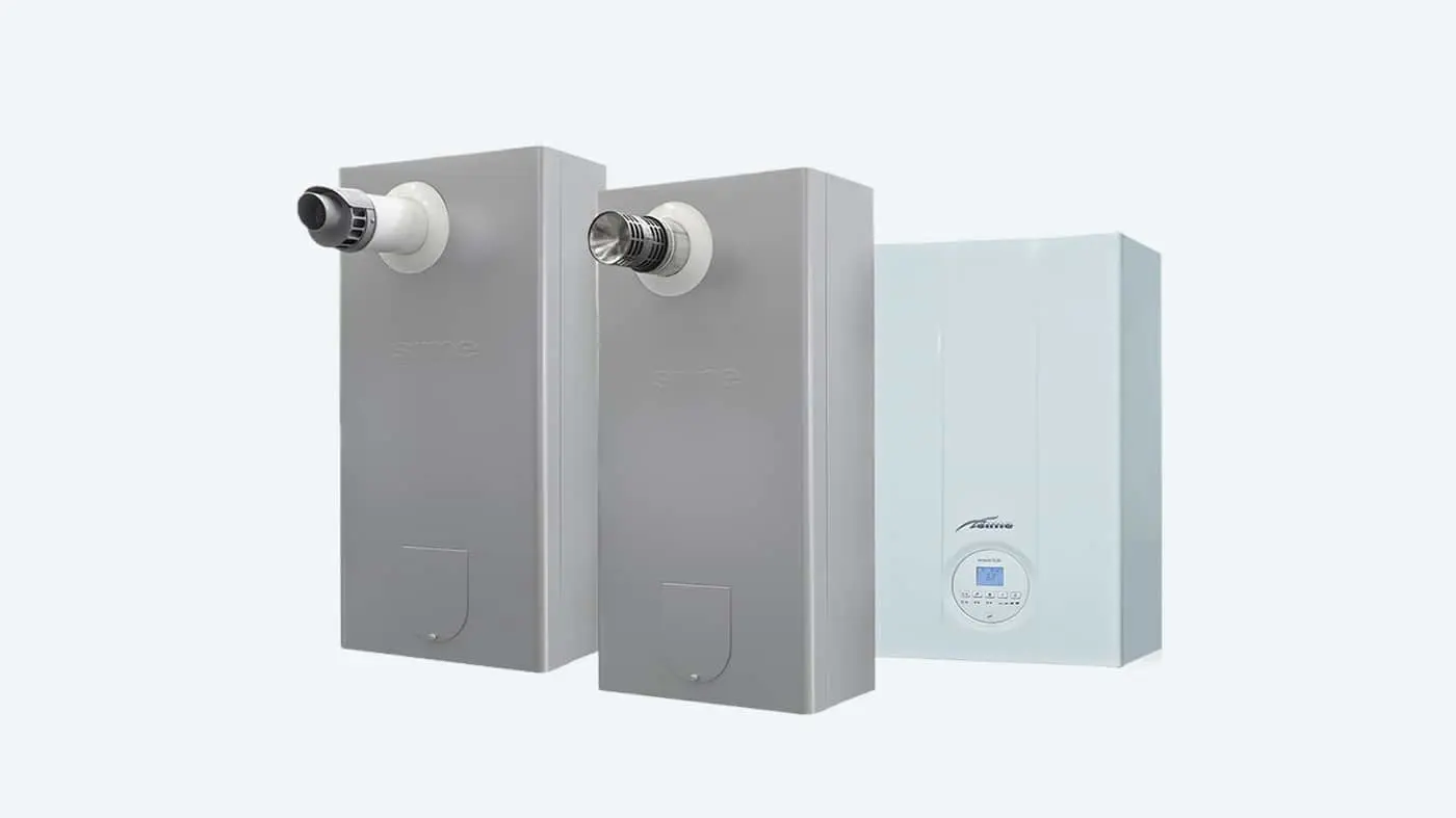 Three wall-mounted boiler units - two gray with exhaust vents and one light blue with digital control panel.
