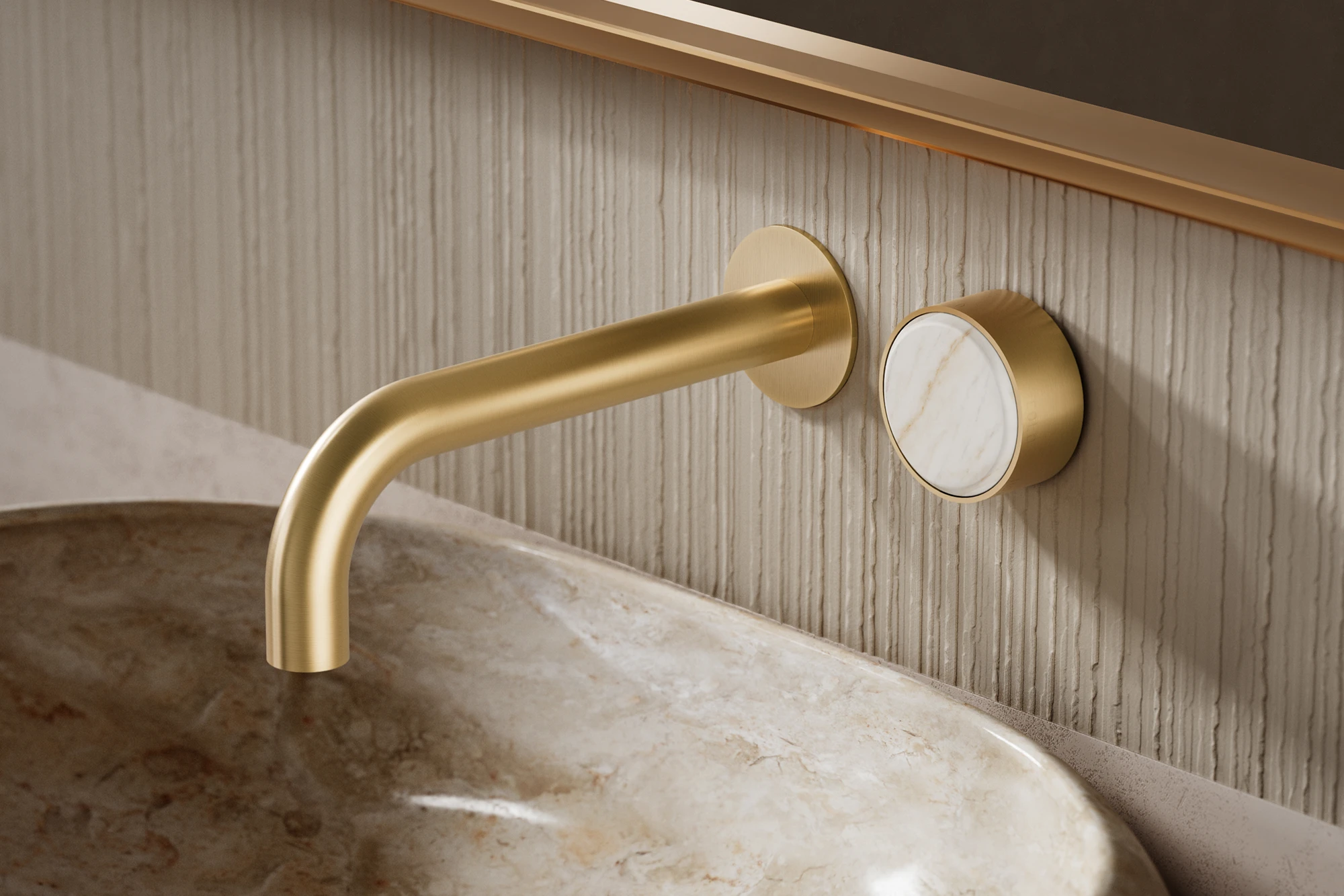 Modern gold wall-mounted faucet with marble control knob above a stone sink against textured beige wall paneling.