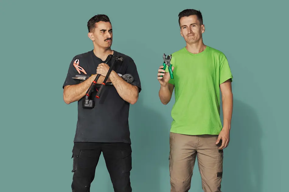 Two men against teal background, one in black shirt holding bolt cutters, another in green shirt with pliers.