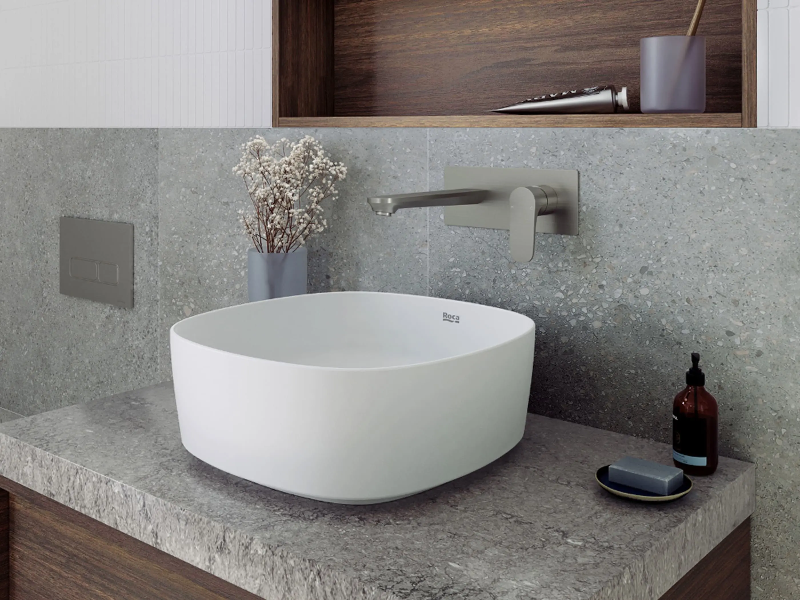 Modern bathroom with white vessel sink, wall-mounted faucet, gray stone countertop, and minimalist decor.
