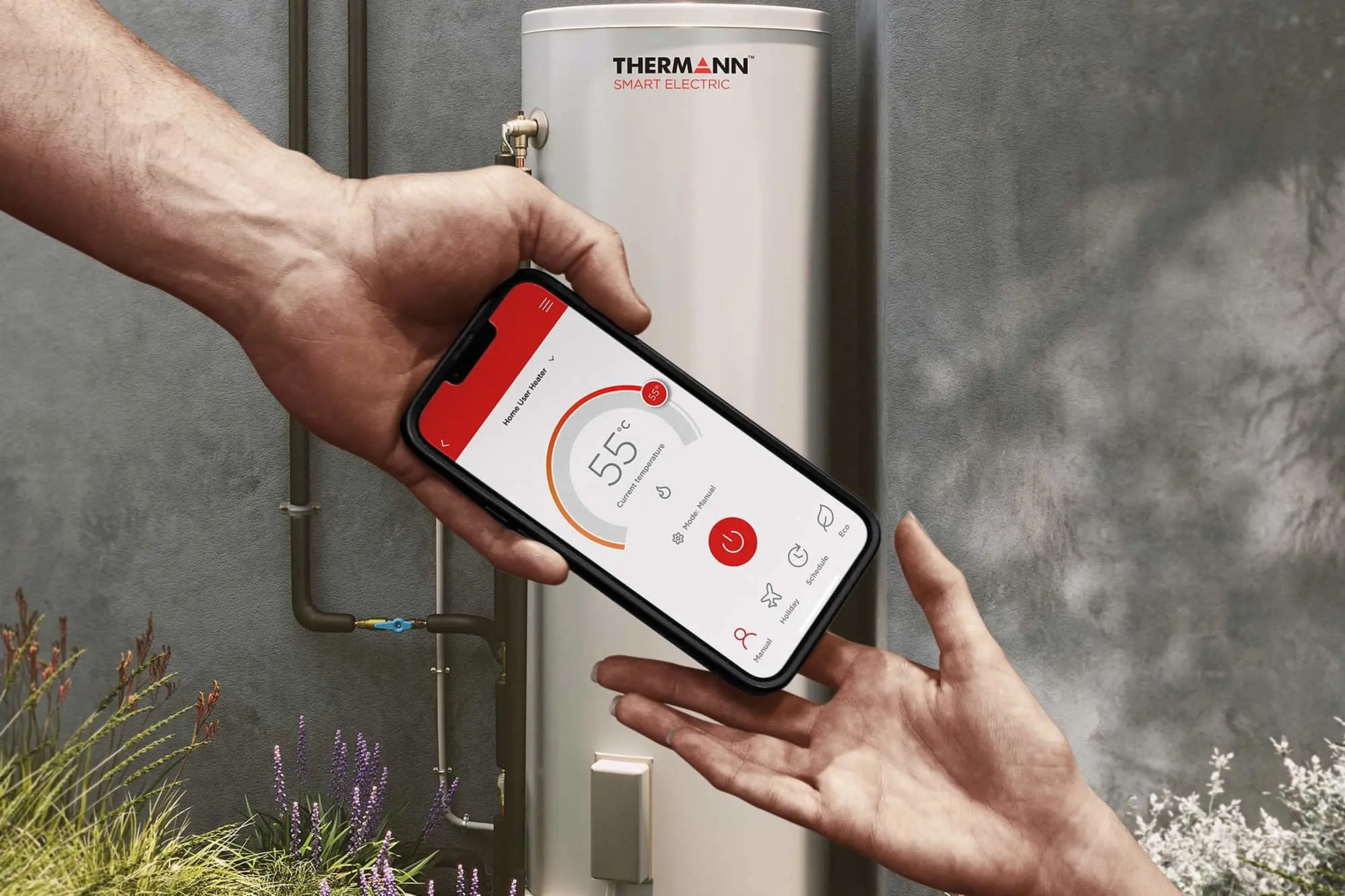 Hand holding smartphone controlling Thermann Smart Electric water heater with temperature set to 55 degrees.