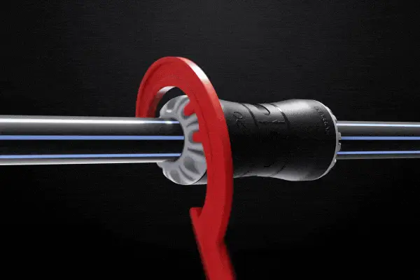 A pipe connector with a red wrench twisting to show install.