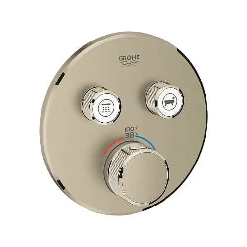 Round beige GROHE shower control panel with temperature dial and two function buttons for shower and bath settings.