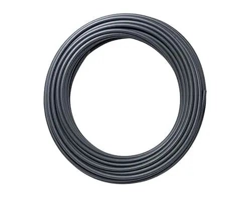 Coiled black pipe forming a circular loop against white background