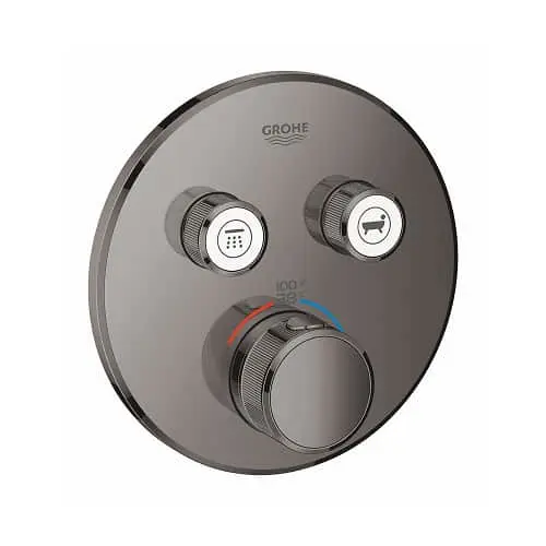 Circular GROHE shower control panel in graphite with temperature dial and two function buttons.