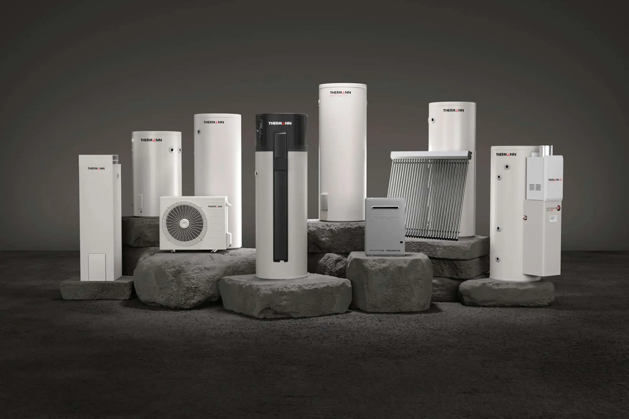 Collection of Thermann water heating systems including tanks, heat pump, solar collector and outdoor units on stone pedestals.