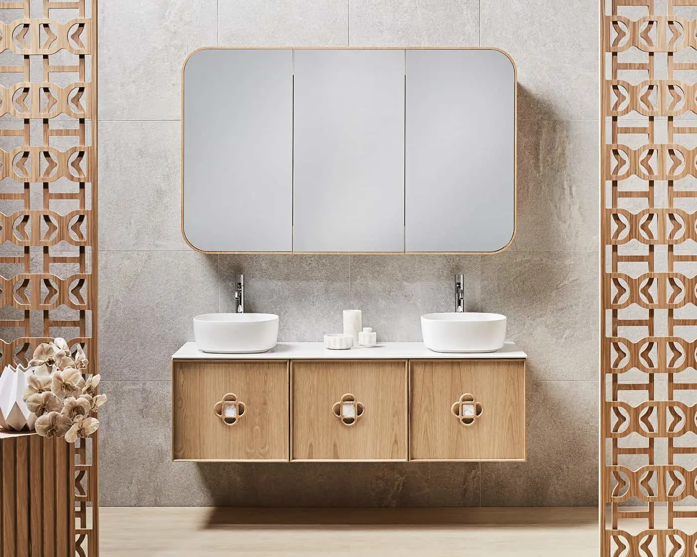 Modern bathroom with wooden vanity cabinet, dual white vessel sinks, large mirror, and decorative wooden screens on sides.
