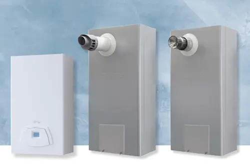 Three home heating units against a blue wall - one white with digital display and two gray with ventilation pipes.