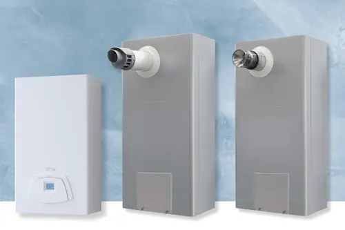 Three home heating units against a blue wall - one white with digital display and two gray with ventilation pipes.