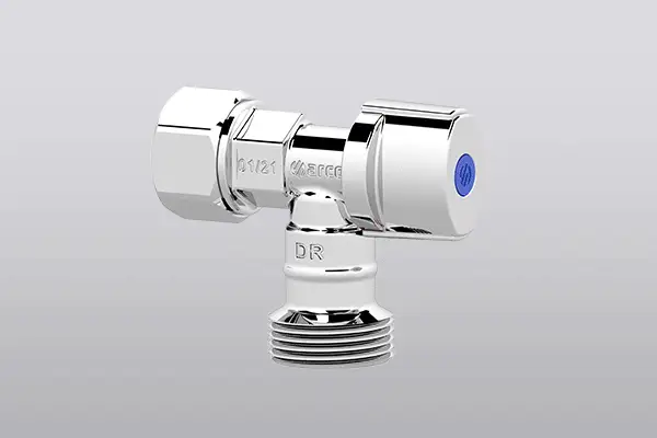 Chrome T-shaped plumbing valve with blue indicator against gray background.