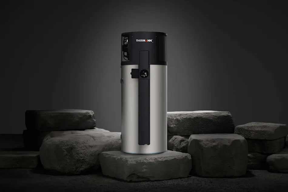 Cylindrical Thermann water heater with black top and silver body displayed on stone platforms against dark background.