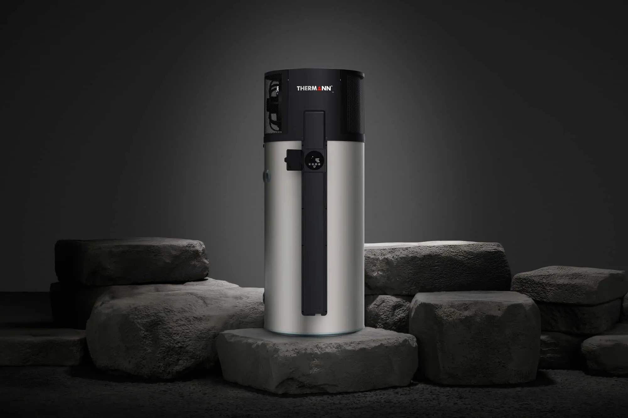 Cylindrical Thermann water heater with black top and silver body displayed on stone platforms against dark background.