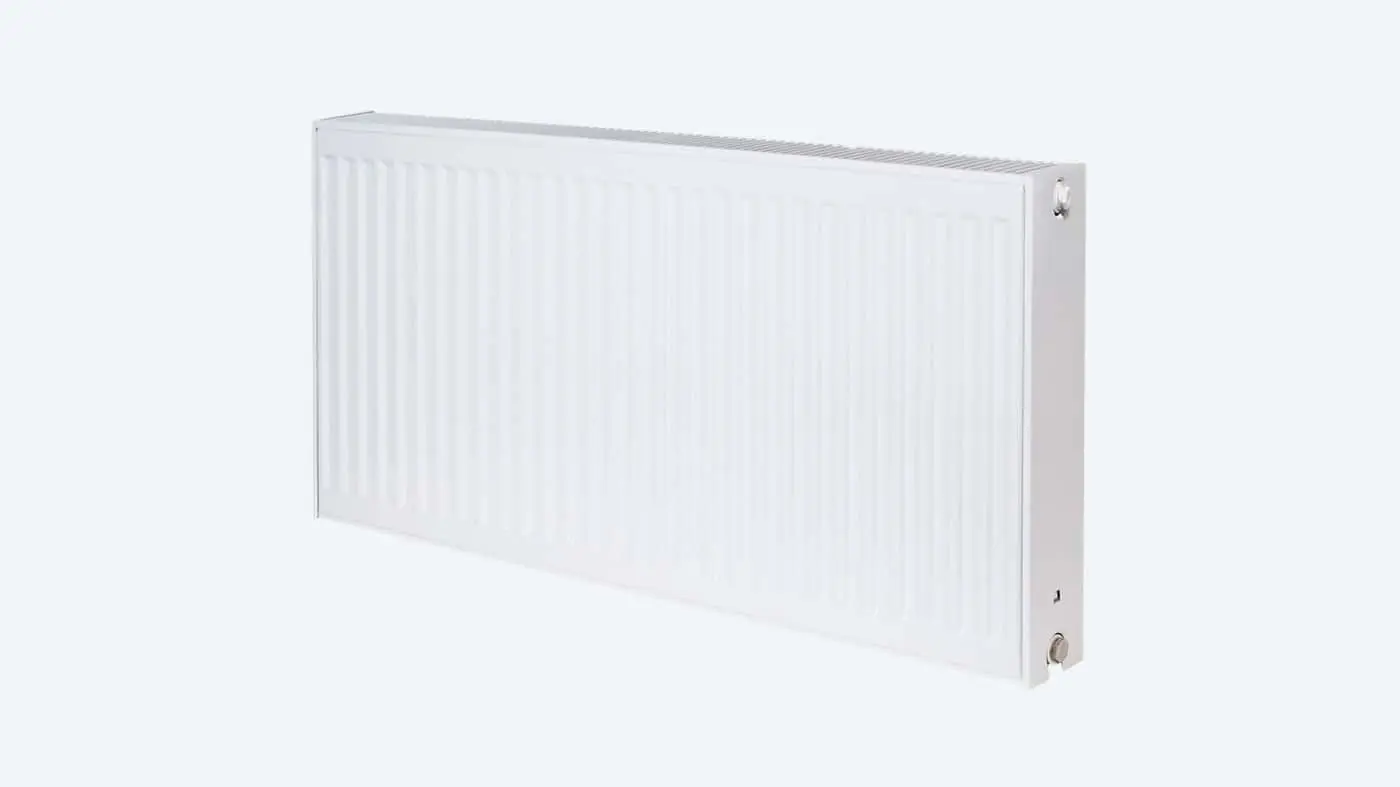 White rectangular panel radiator with vertical ridges and connection valves on the side against white background.