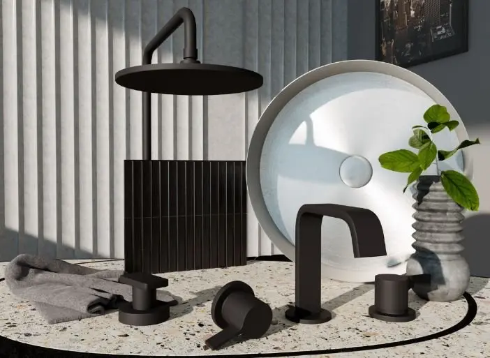 Modern black bathroom fixtures including shower head, faucet and handles on terrazzo surface with decorative mirror and plant.