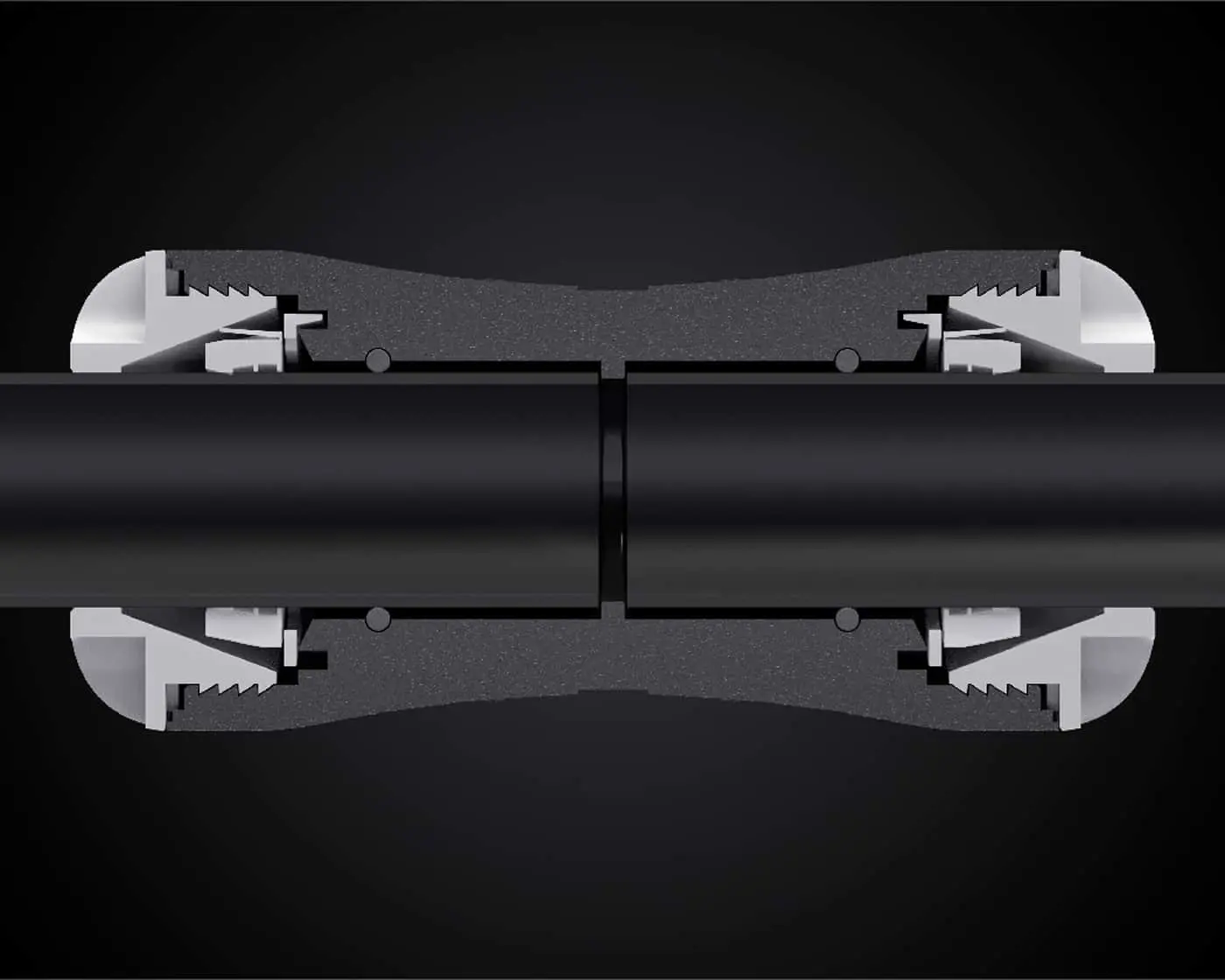 Cross-section view of a pipe connection system showing gray clamp mechanisms securing two black pipes against a dark background.