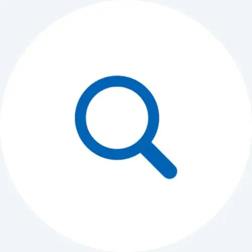 Blue magnifying glass icon on a light gray circular background, representing search functionality.