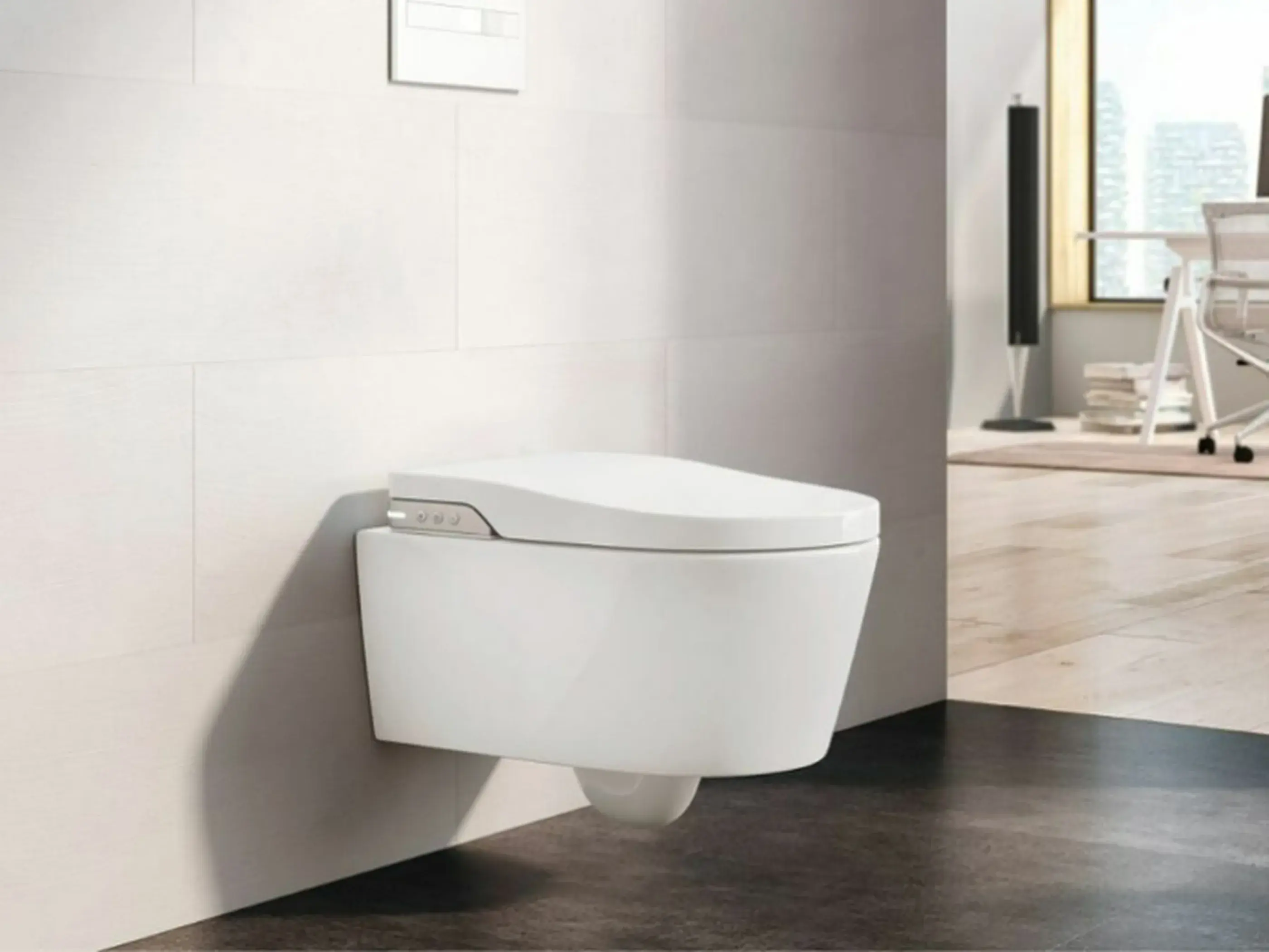 Modern wall-mounted white smart toilet with control panel in a minimalist bathroom with white walls and dark floor.