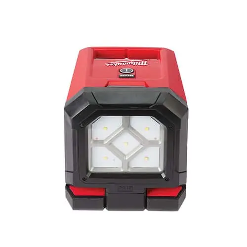 Red and black Milwaukee portable LED work light with multiple bright bulbs in a compact, durable housing.