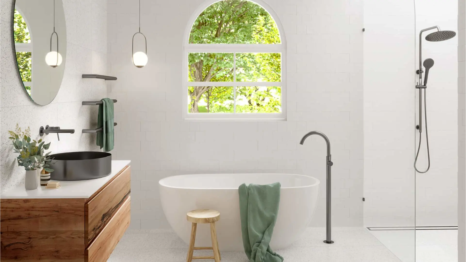 Modern white bathroom with freestanding tub, black sink, wooden vanity, arched window, and green towels.