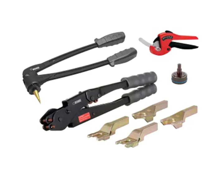 Plumbing tools including black rivet gun, red pipe cutter, metal attachments, and a small circular component.