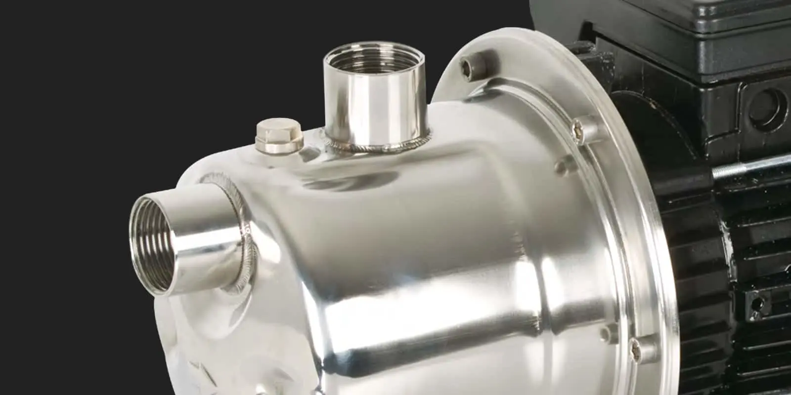 Stainless steel industrial pump housing with threaded ports and mounting flange connected to a black motor unit.