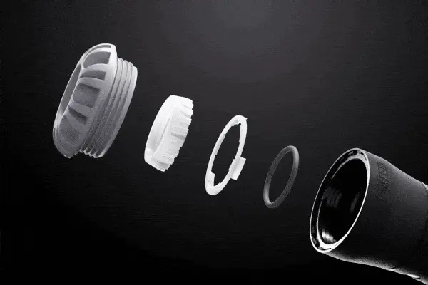 Internal parts of a pipe connector moving into place to show how it is built.