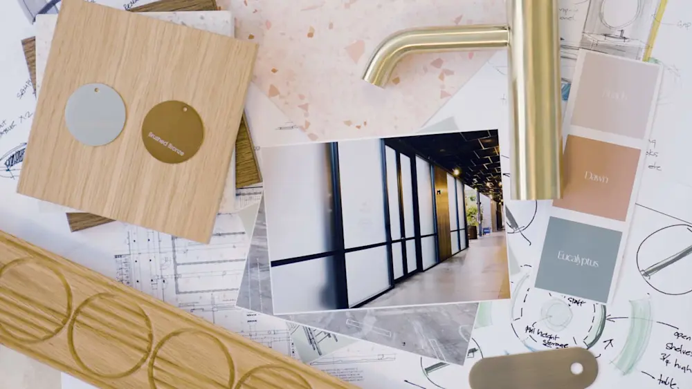 Interior design materials including wood samples, color swatches, and a hallway photo spread across architectural plans.