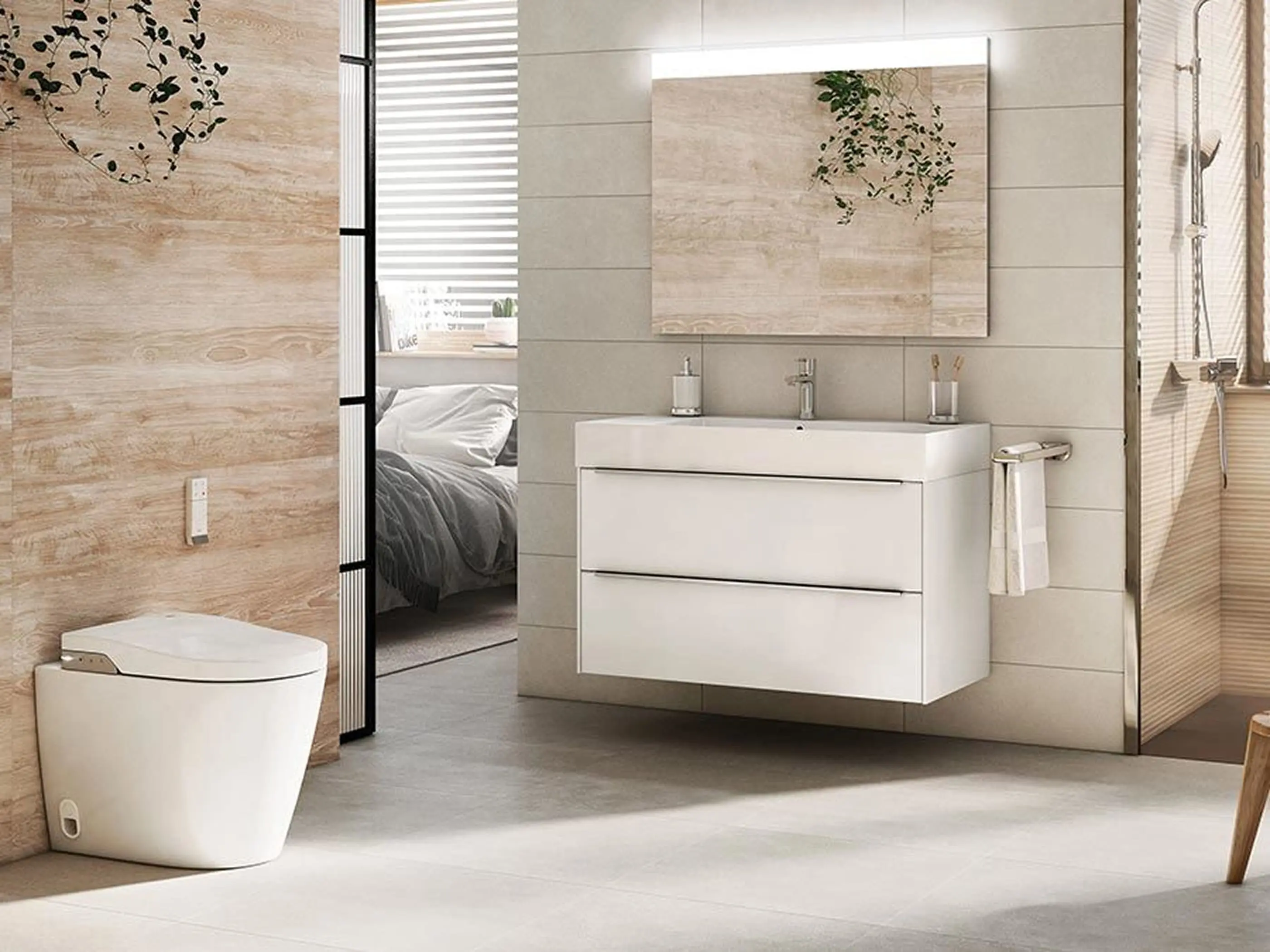 Modern bathroom with white vanity, illuminated mirror, and beige tile walls, adjacent to bedroom with glimpse of bed visible.