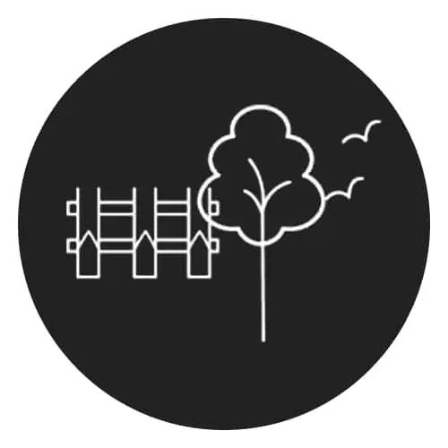 Simple line drawing of a fence and tree with birds flying in the sky on a black circular background.