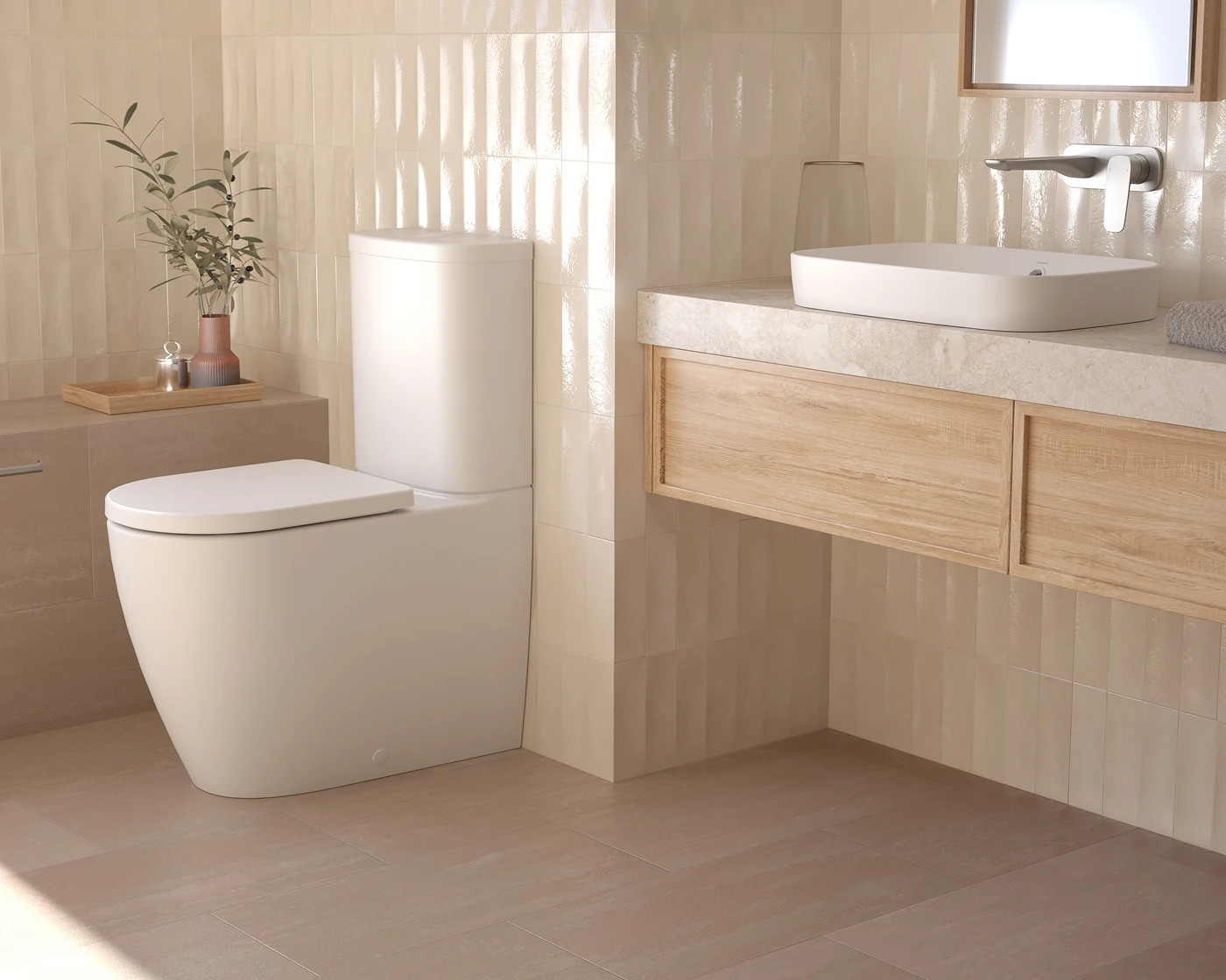 Modern bathroom with white toilet, wooden vanity with vessel sink, beige tiled walls, and small potted plant.
