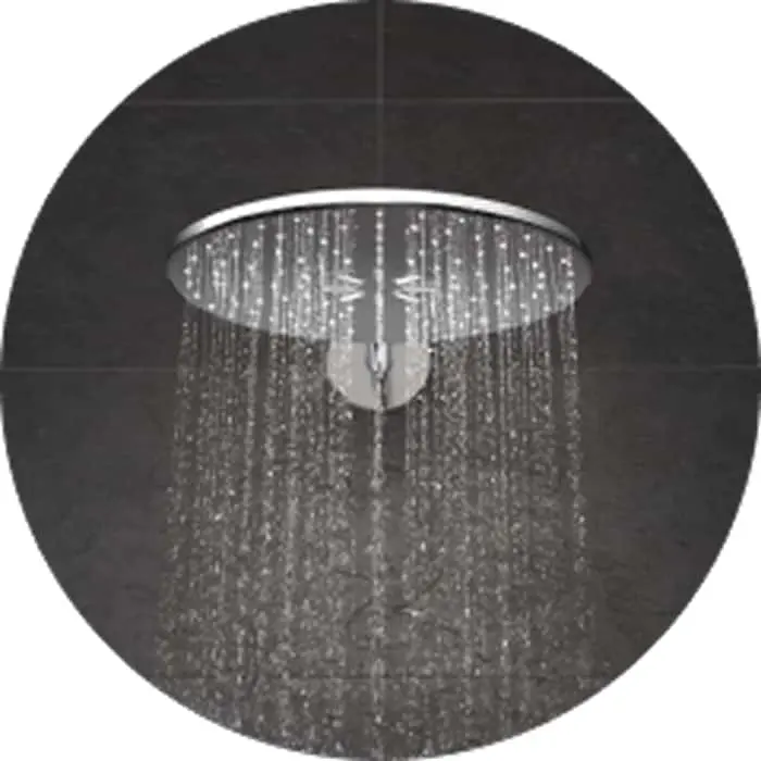 Modern circular rainfall shower head with water streaming down against a dark tile background.