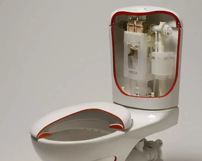 White toilet with red trim showing internal tank mechanism with visible flush components.